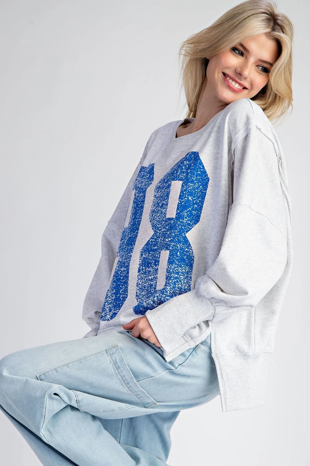 Faded varsity print long sleeve pullover top